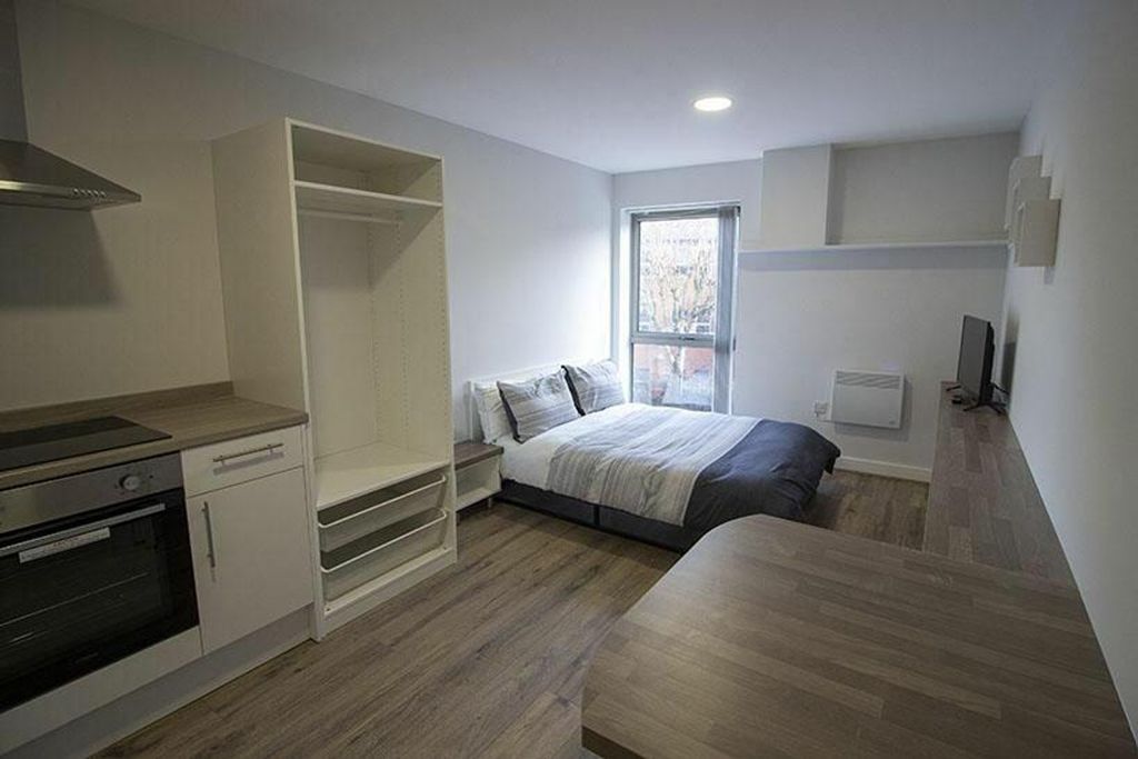 Property photo 3 of 4 This Stylish Double Bedroom Features A Cozy Atmosp...