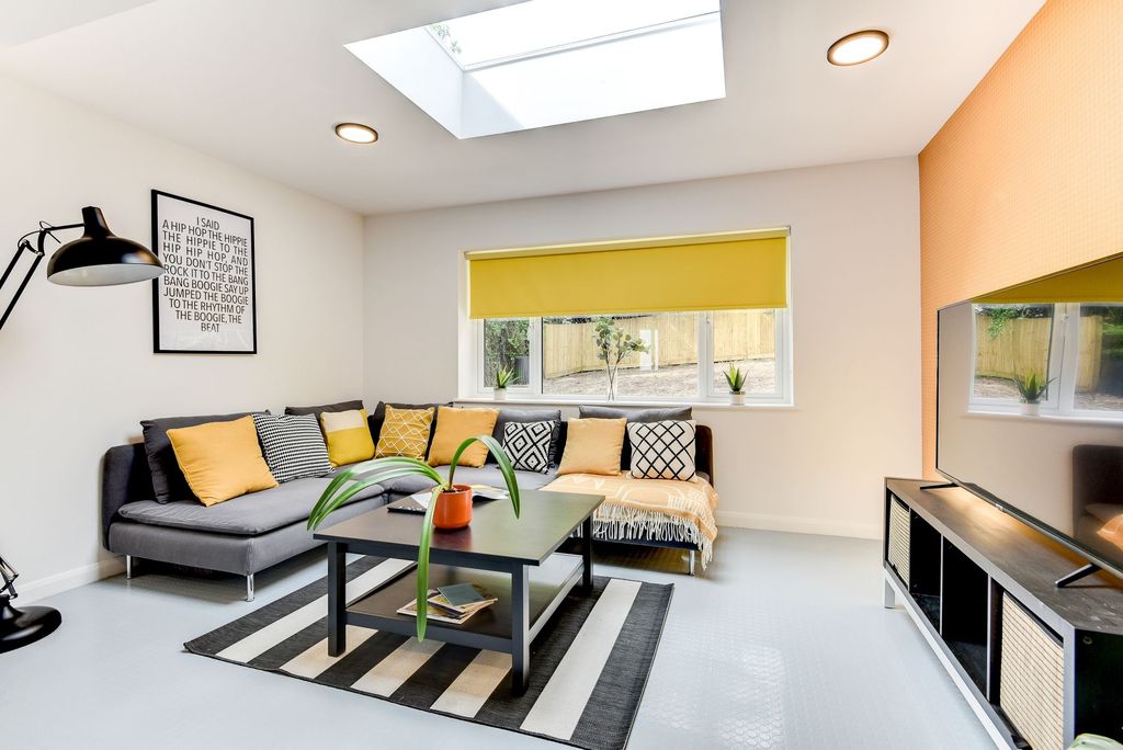 Property photo 2 of 5 Bright And Inviting Living Room Featuring A Cozy S...