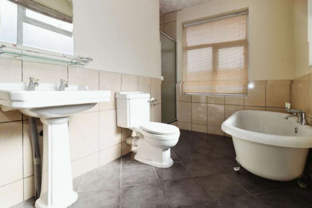 Property photo 3 of 9 This Spacious Bathroom Suite Features A Stylish Fr...