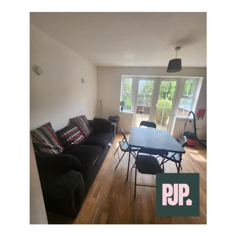 Property photo 1 of 9 Spacious Living Room Featuring Large Windows That ...