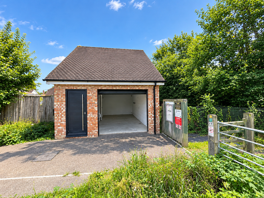 Property photo 3 of 11 Outside Of Property- Garage Door Open