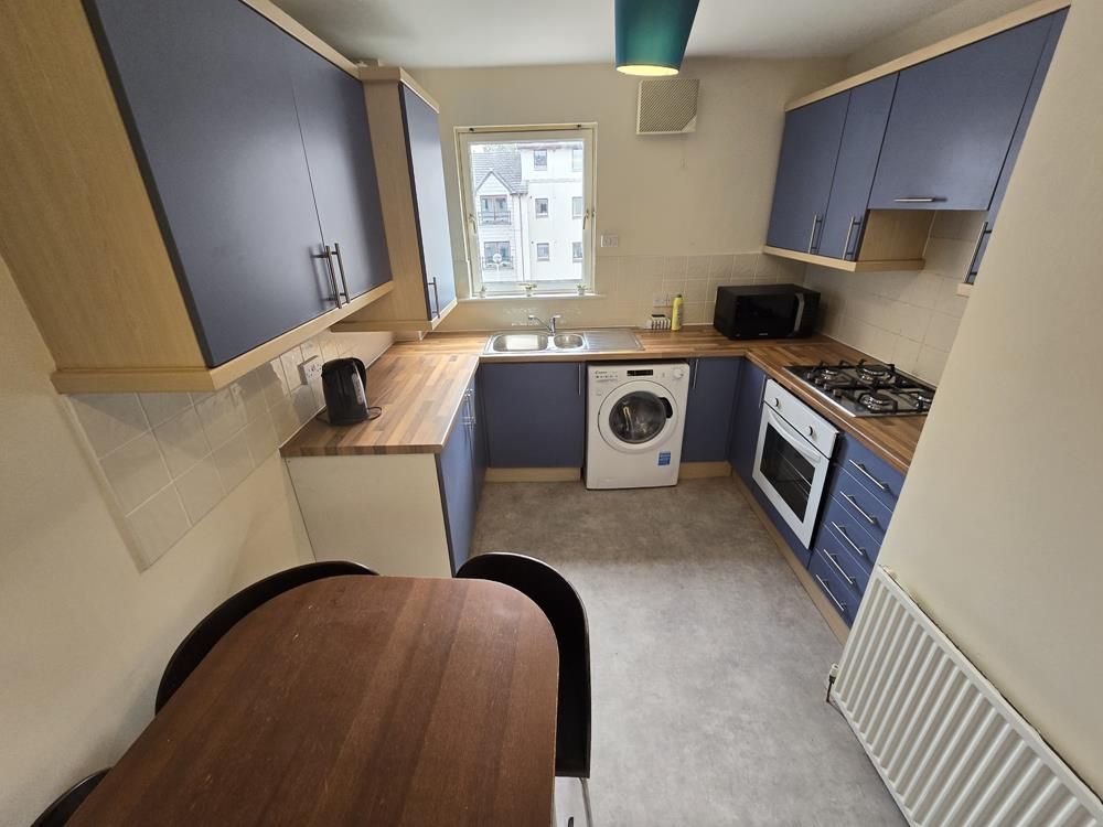 Property photo 3 of 8 Kitchen