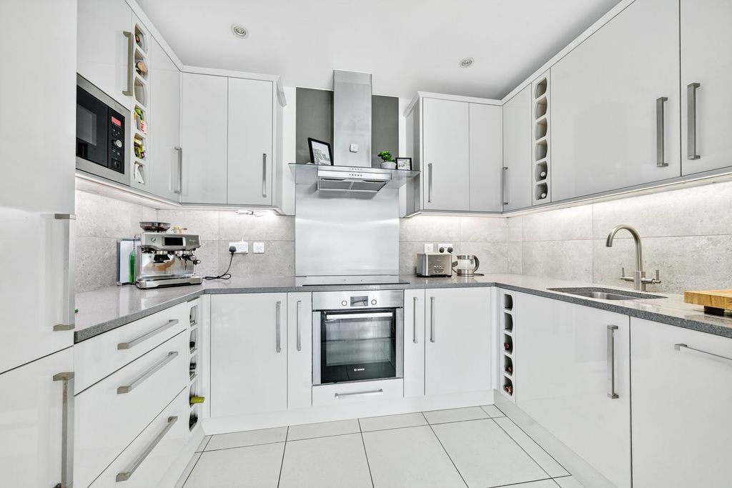 Property photo 3 of 16 Modern Kitchen With Integrated Appliances, Designed For Both Style And Functionality.