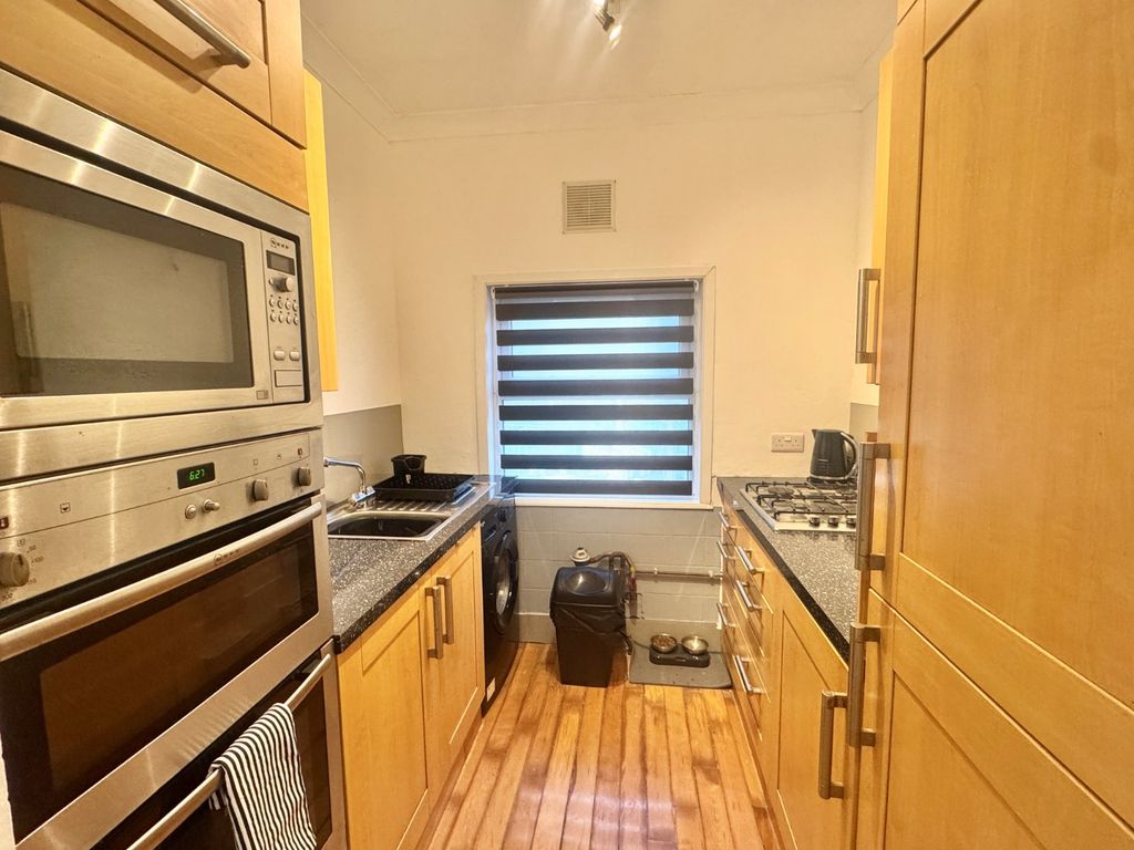 Property photo 3 of 8 Kitchen