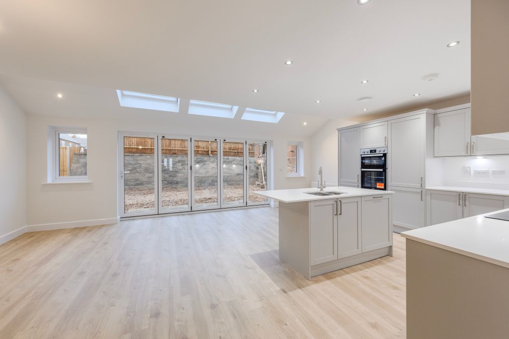 Property photo 3 of 11 Kitchen/Dining/Family Area