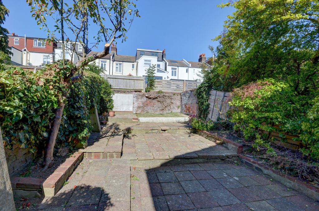 Property photo 1 of 19 Sunny Paved Rear Garden With Terraced Planting Bed...
