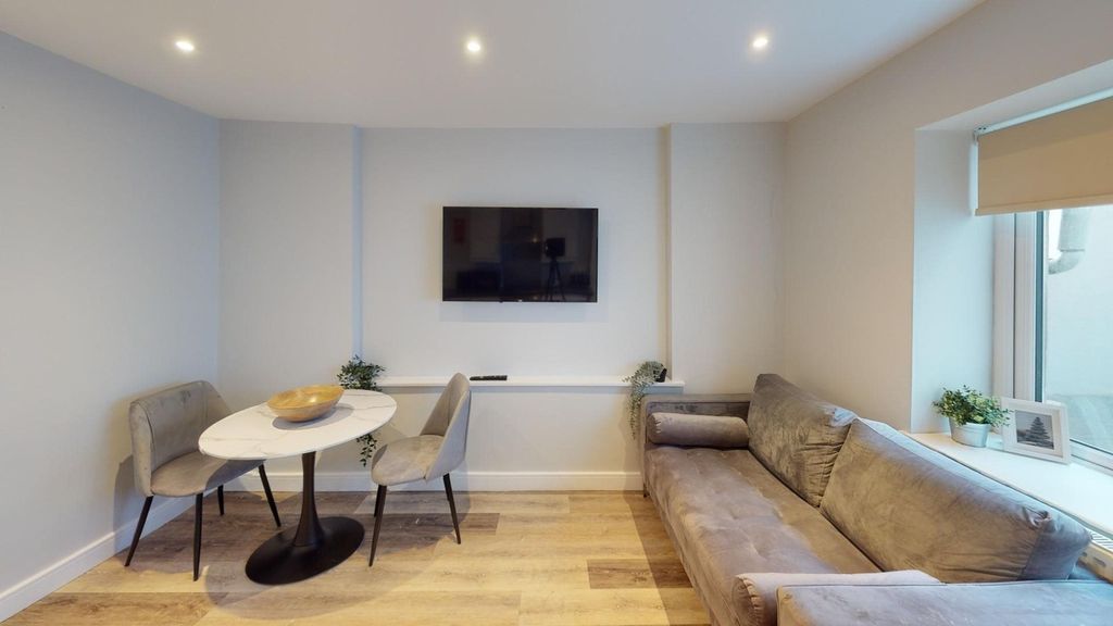 Property photo 3 of 8 A Bright And Inviting Large Modern Living Room Wit...