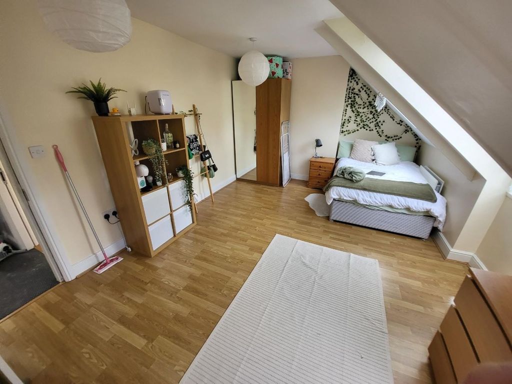 Property photo 2 of 11 A Bright And Welcoming Living Room Featuring A Com...