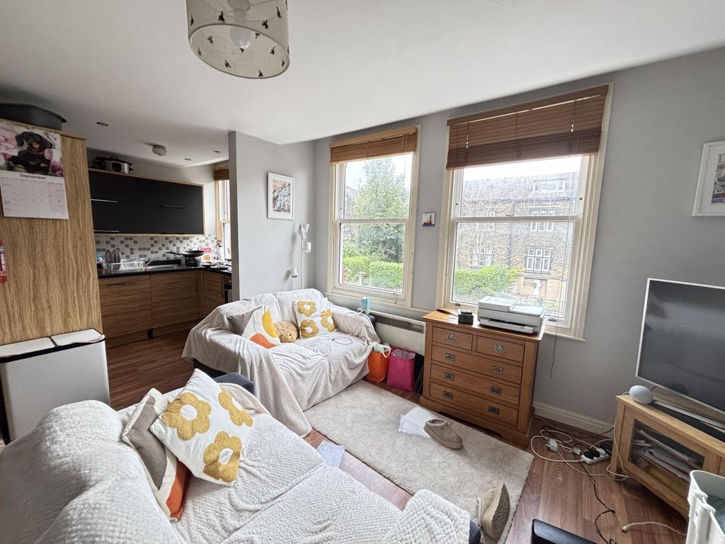 Property photo 3 of 16 A Bright And Inviting Living Room Featuring Large ...