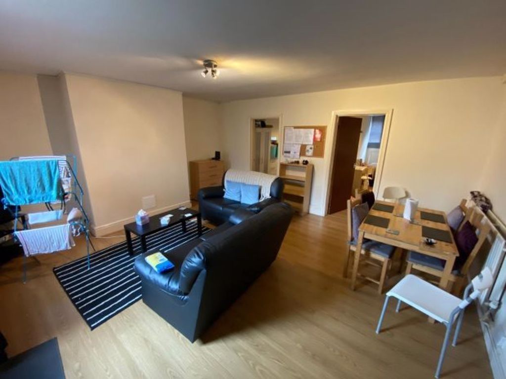 Property photo 2 of 10 A Cozy Living Room Featuring Wooden Flooring, A Co...