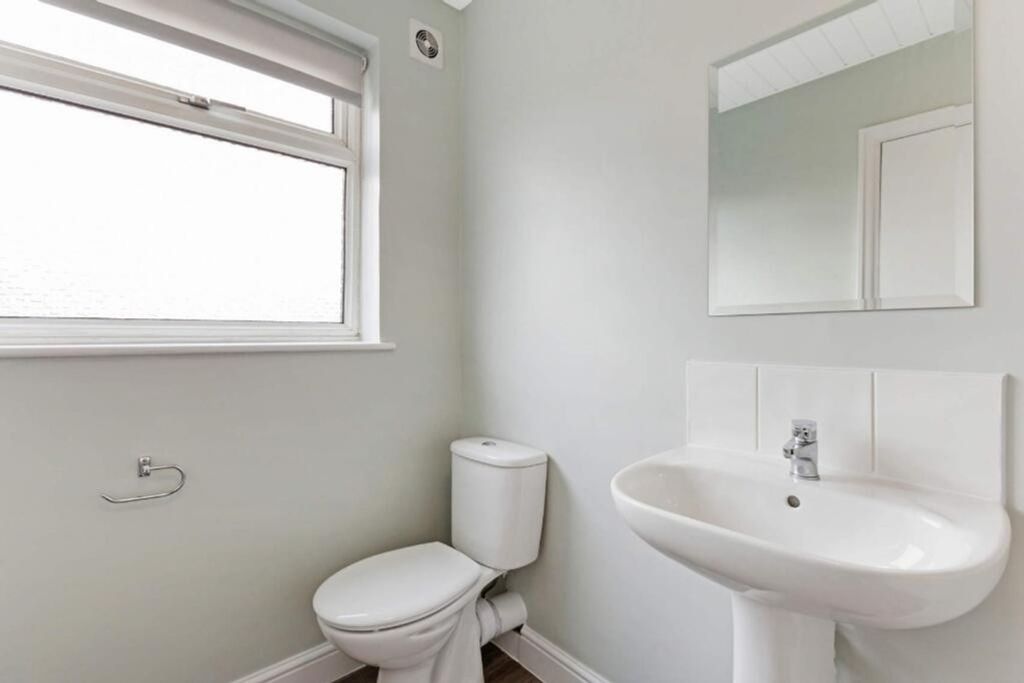 Property photo 3 of 9 A Bright And Modern Bathroom Featuring A Sleek Sin...