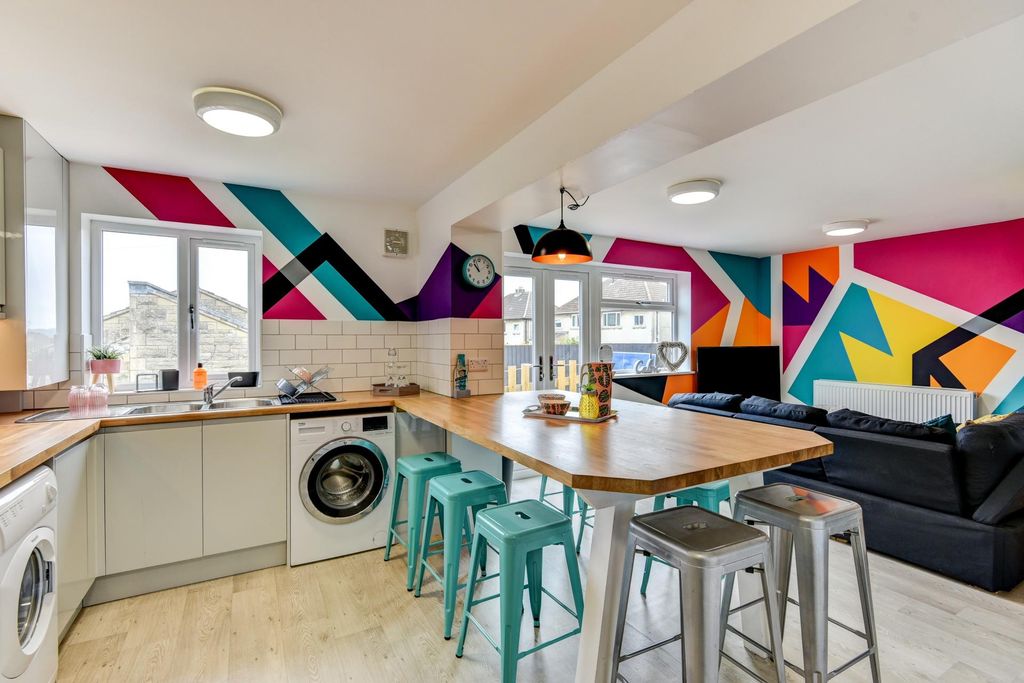 Property photo 2 of 5 This Vibrant And Modern Kitchen Boasts A Spacious ...