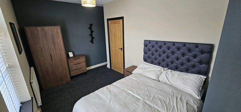 Property photo 3 of 10 A Cozy Double Bedroom Featuring A Tufted Headboard...