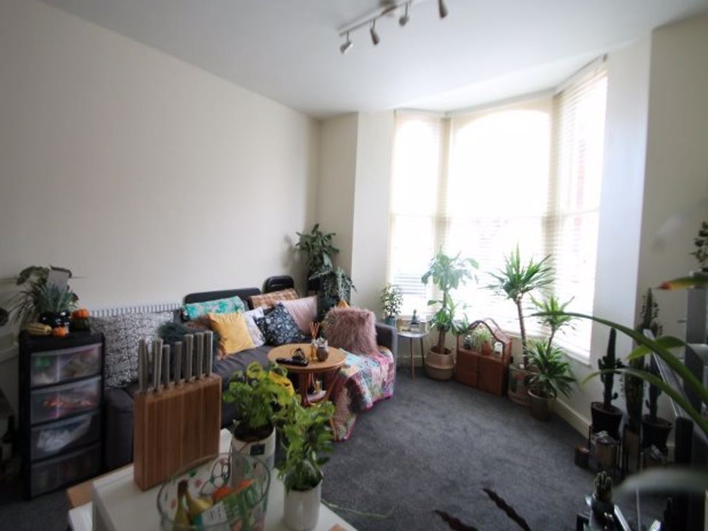 Property photo 2 of 14 A Bright And Welcoming Living Room Filled With Nat...