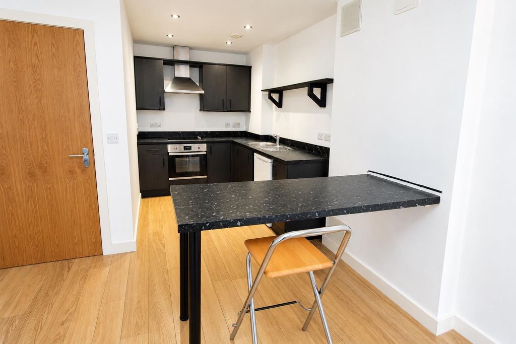 Property photo 1 of 9 Modern Open Kitchen With Stylish Breakfast Bar...