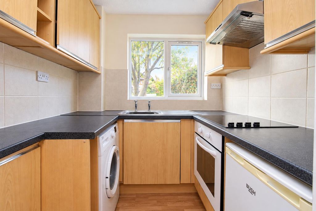 Property photo 2 of 6 Bright Neutral Galley Kitchen With Garden View.Png