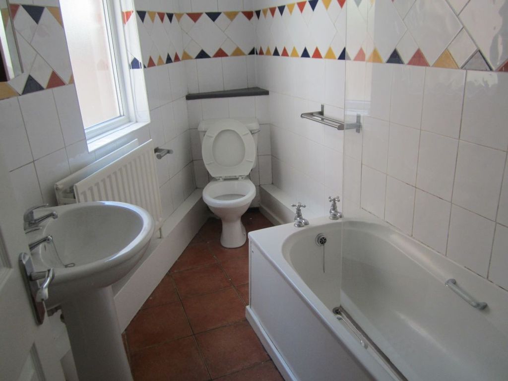 Property photo 2 of 8 Bright And Spacious Bathroom Featuring A Modern Ba...