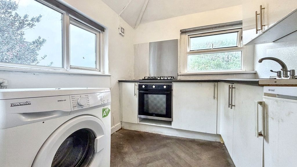 Property photo 2 of 6 Bright, Modern Kitchen With White Cabinetry, Integ...