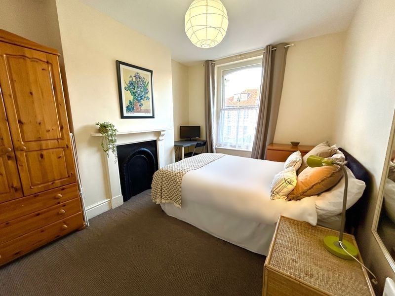 Property photo 1 of 6 A Charming Double Bedroom Featuring A Cozy Bed, St...