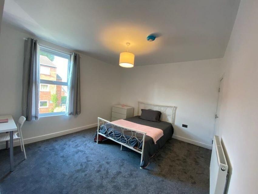 Property photo 3 of 15 Bright And Inviting Master Bedroom Featuring A Lar...