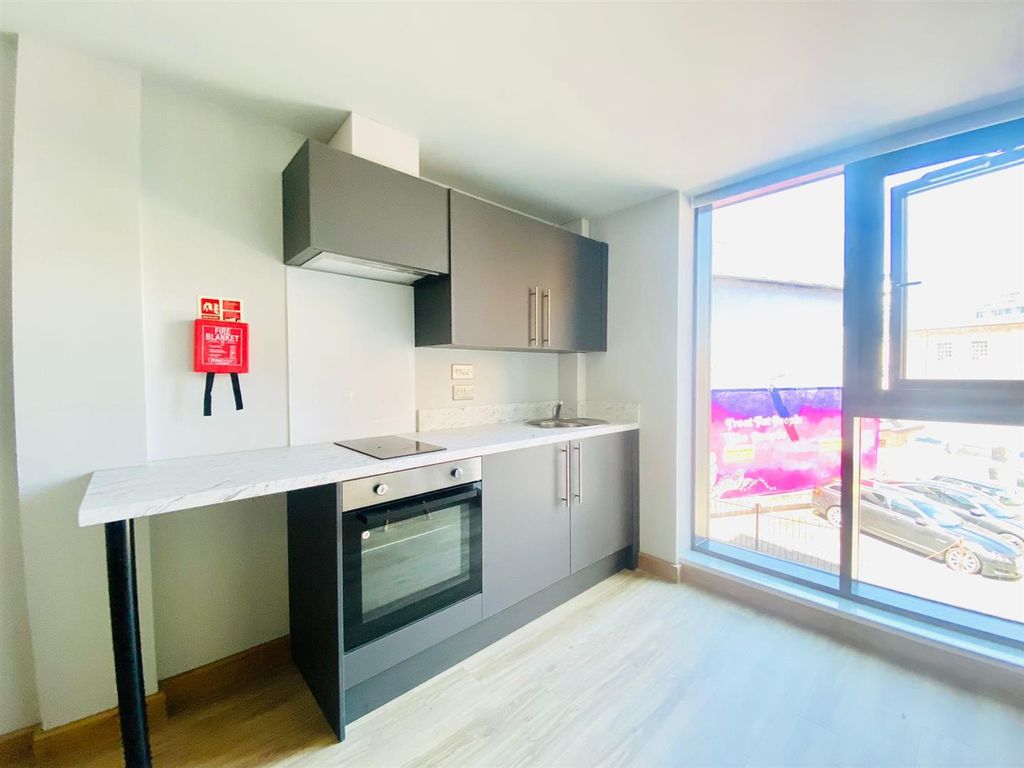 Property photo 1 of 17 Kitchen Area