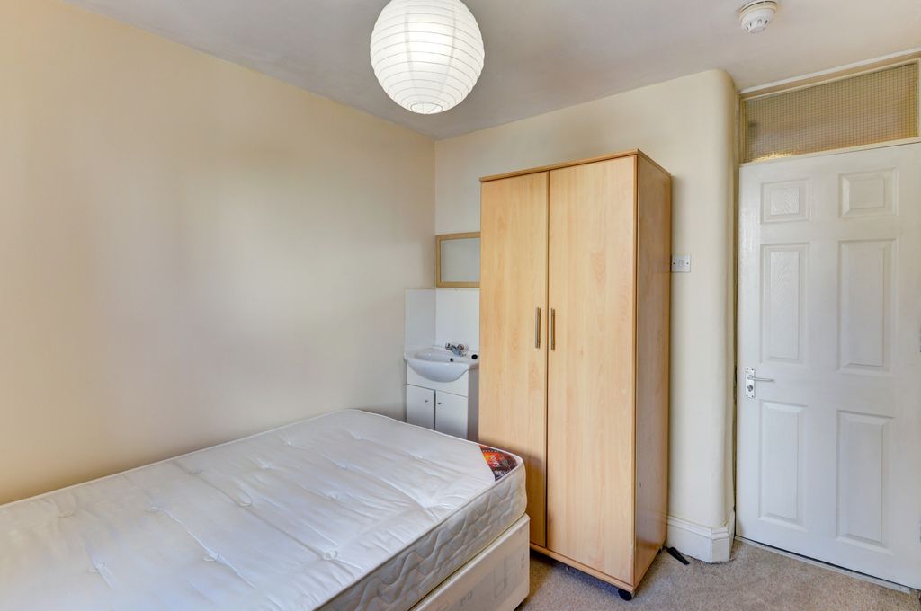 Property photo 2 of 13 A Cozy Bedroom Featuring A Single Bed, A Wardrobe,...