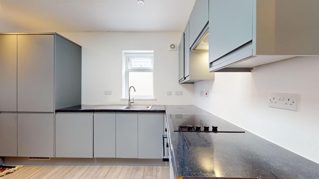 Property photo 2 of 19 Modern Fitted Kitchen With Sleek Grey Cabinetry, A...