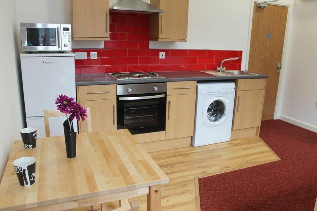 Property photo 2 of 3 This Modern Kitchen Features A Stylish Design With...