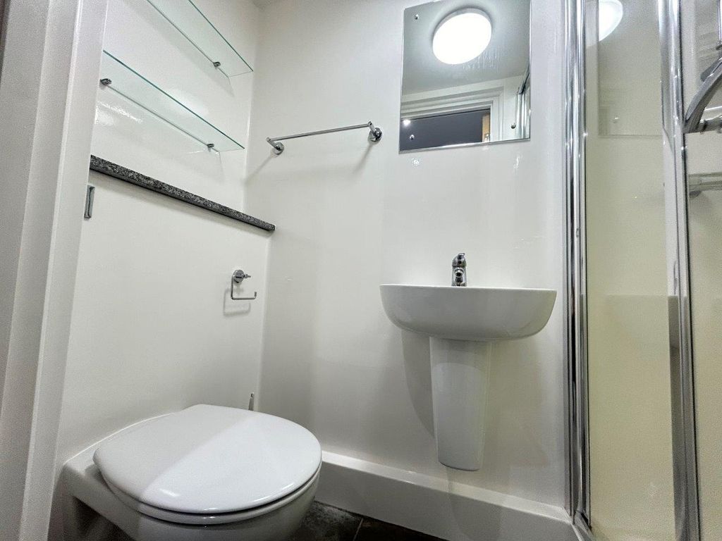 Property photo 2 of 13 Clean Modern Ensuite With Sleek Glass Shelving...