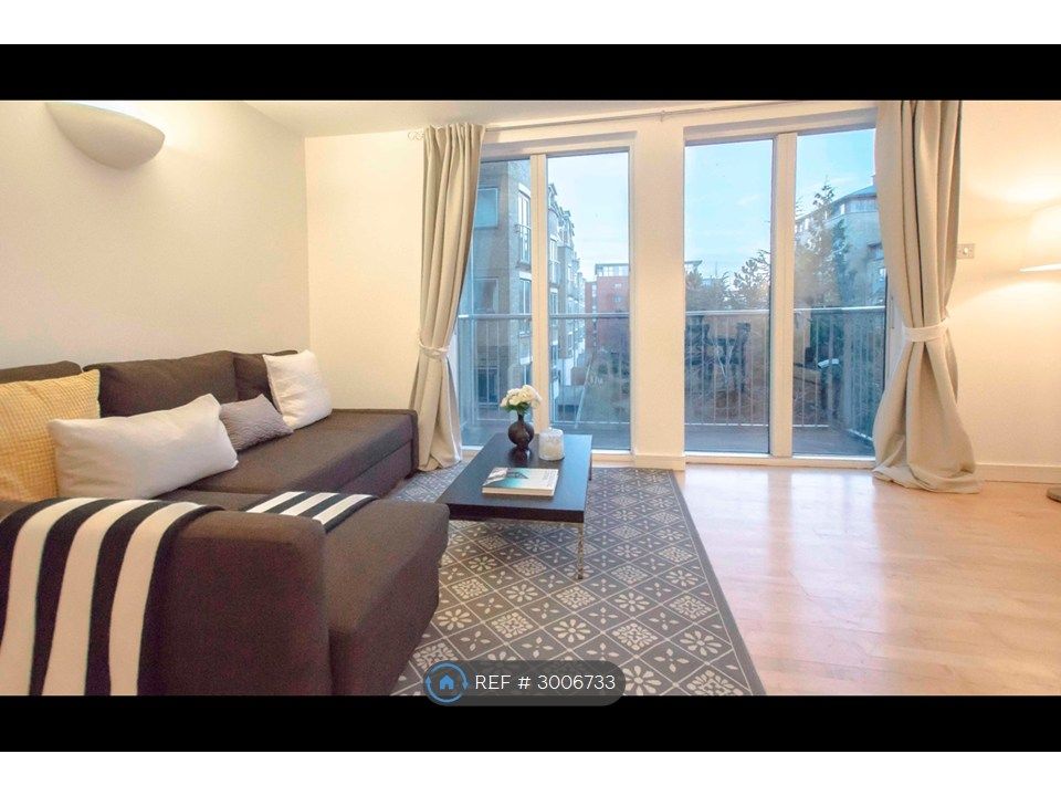Property photo 2 of 9 Living Room With Laminated Wooden Flooring