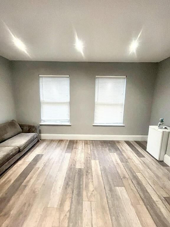 Property photo 2 of 9 A Bright, Spacious Living Room With Two Large Wind...