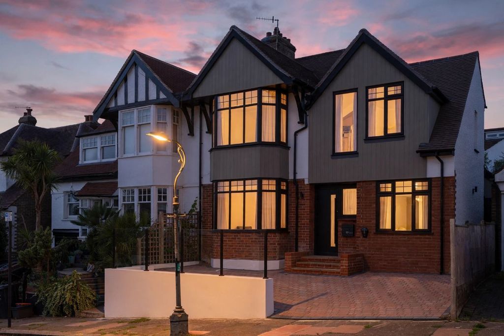 Property photo 1 of 16 Twilight Image Of The Front Of The House