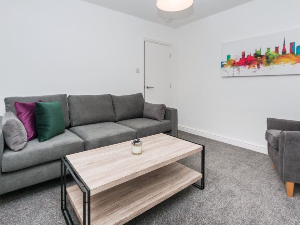 Property photo 3 of 19 Bright, Modern Living Room With A Comfortable Grey...