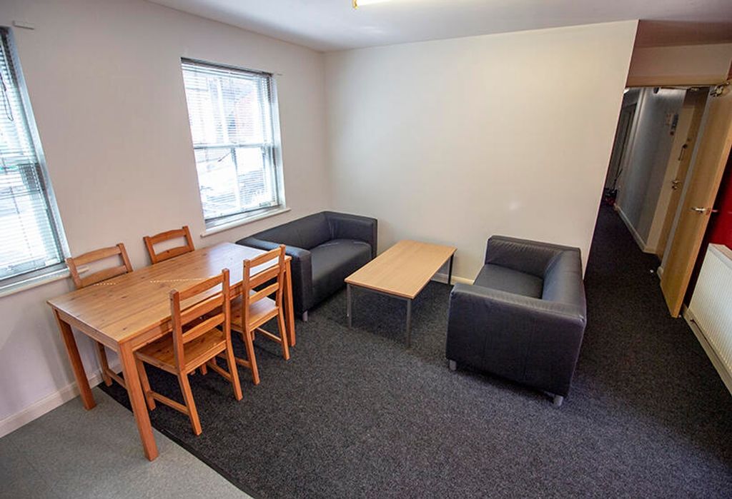 Property photo 1 of 4 Bright And Inviting Living Room Featuring Comforta...