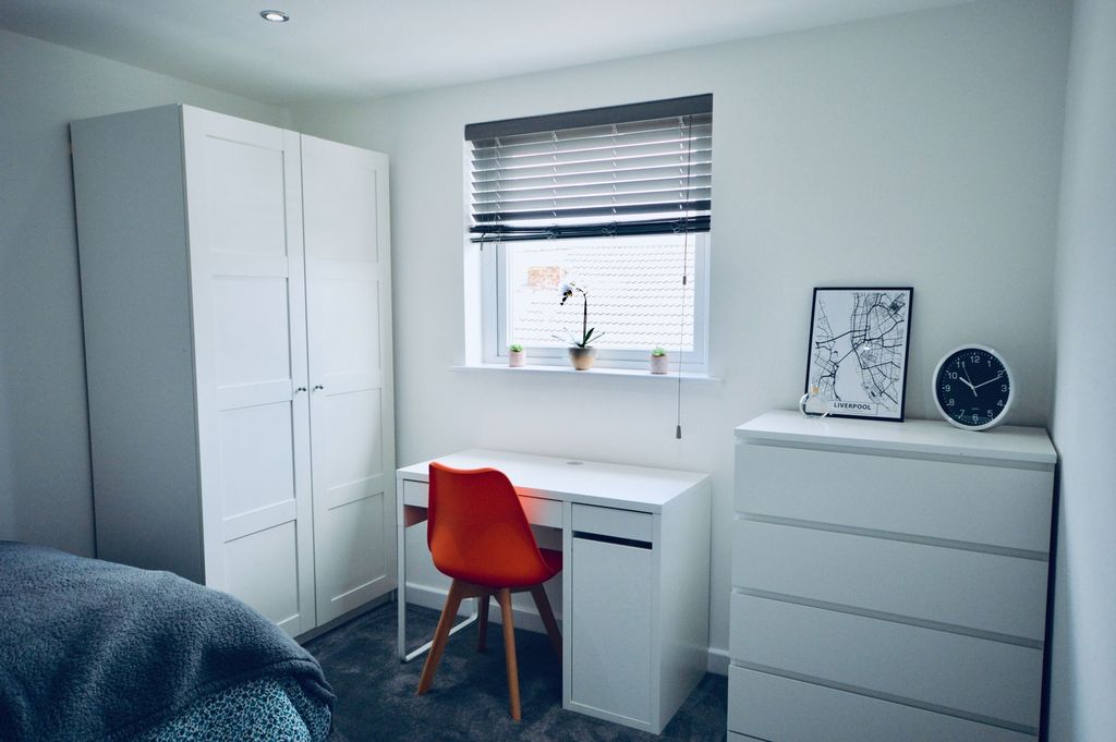Property photo 2 of 4 A Well-Lit, Modern Bedroom Featuring A Wardrobe, A...