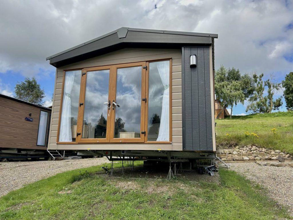 Property photo 1 of 12 Exterior Of The Regal Charmouth Holiday Caravan With Feature Cladding And Patio Doors
