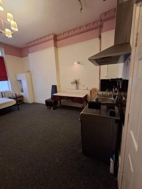 Property photo 3 of 4 Expansive Bedroom With Convenient Kitchenette Area...