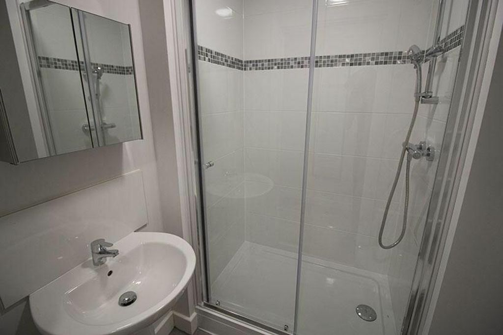 Property photo 3 of 3 Bright And Modern Bathroom Featuring A Walk-In Sho...