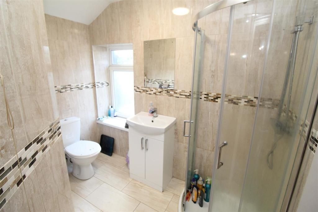 Property photo 3 of 12 Modern Tiled Bathroom With Sleek Corner Shower...
