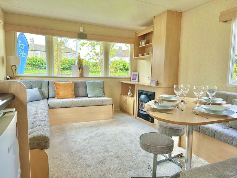 Property photo 1 of 12 Bright, Open Plan Lounge With Wraparound Seating, Dining Area And Fireplace In The Abi Vista