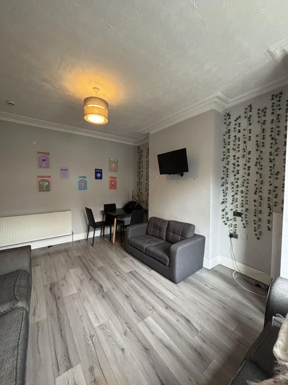 Property photo 1 of 19 Bright And Inviting Living Room Featuring A Comfor...