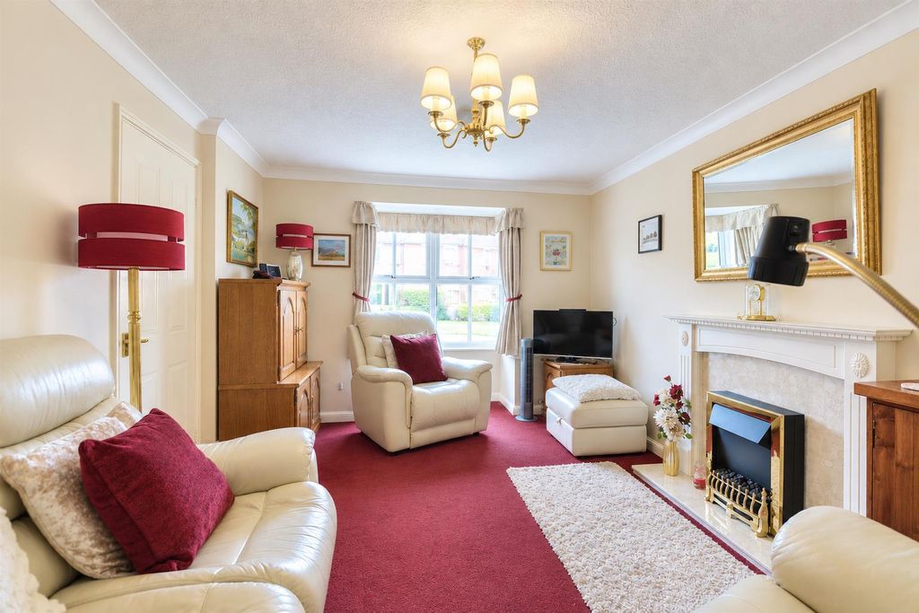 Property photo 2 of 29 Warm Traditional Living Room With Burgundy Accents