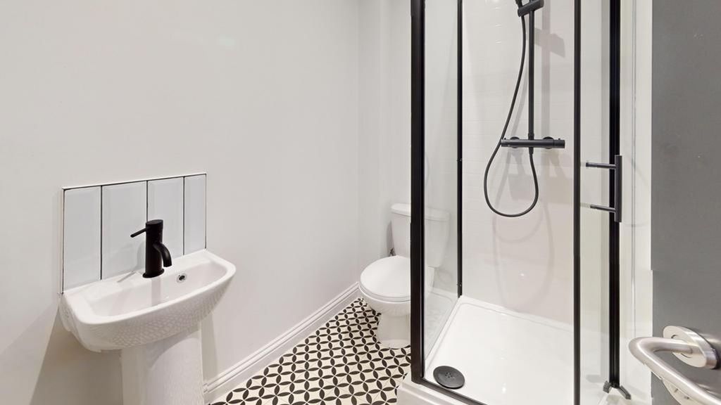 Property photo 3 of 23 A Modern And Stylish Bathroom Featuring A Sleek Sh...