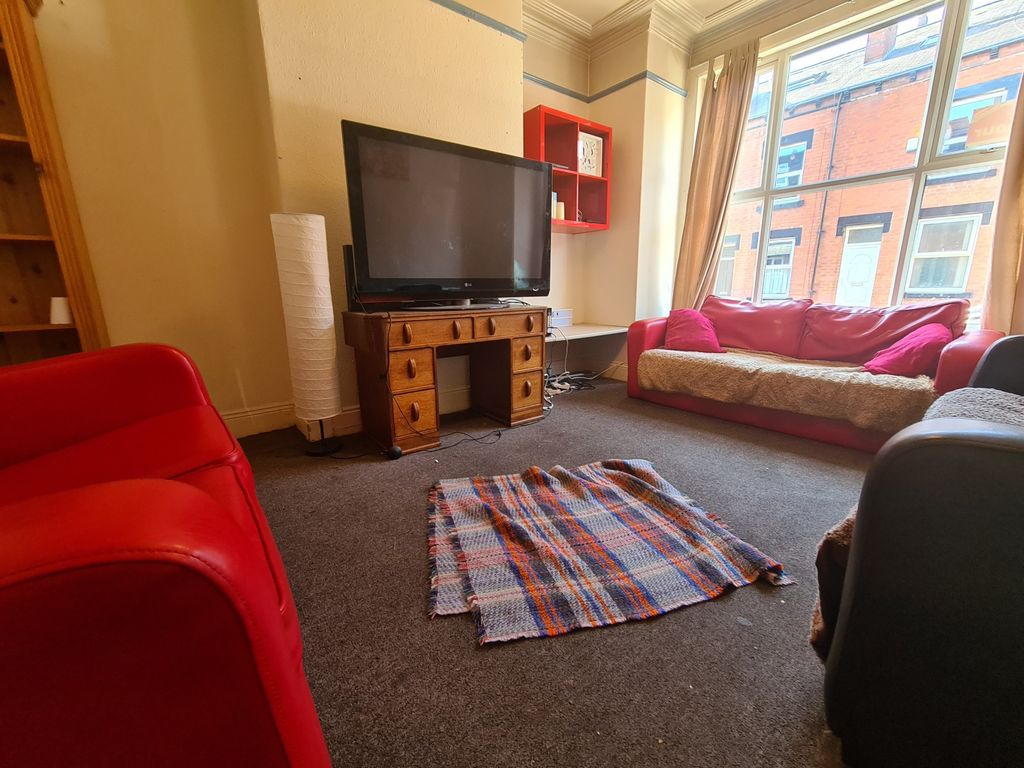 Property photo 2 of 15 A Bright, Welcoming Living Room Featuring Large Wi...
