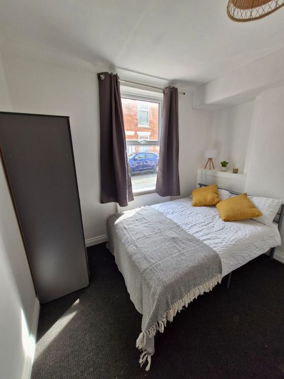 Property photo 3 of 9 A Cozy, Well-Maintained Bedroom Featuring A Double...