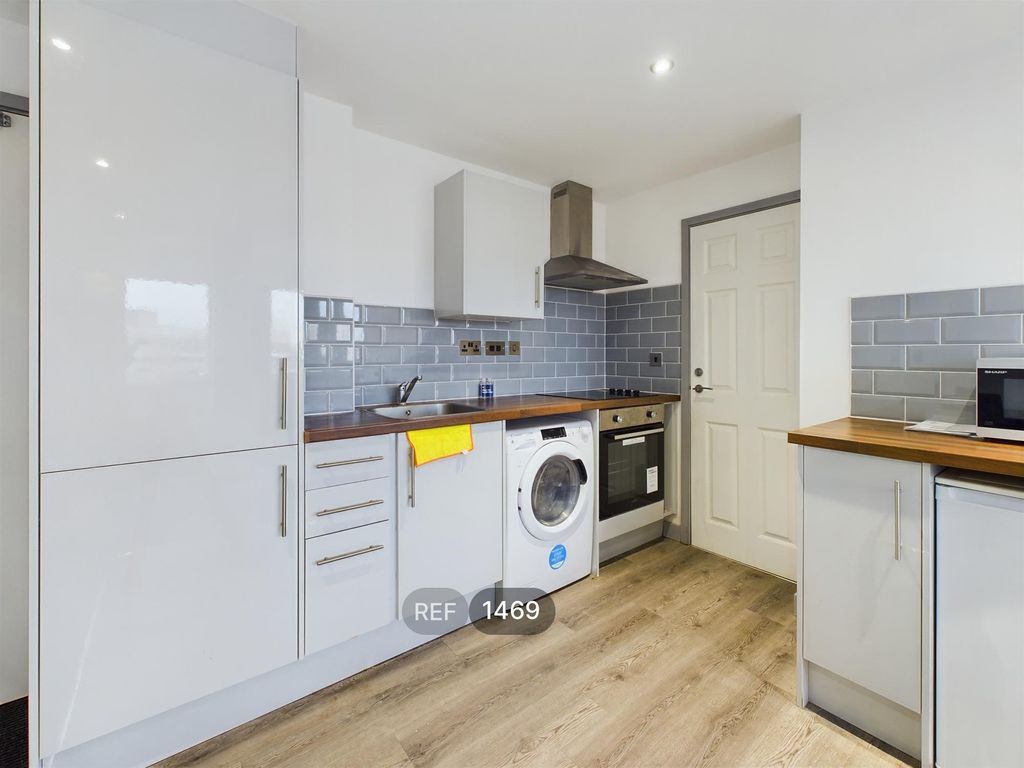 Property photo 1 of 12 Kitchen & Living Area