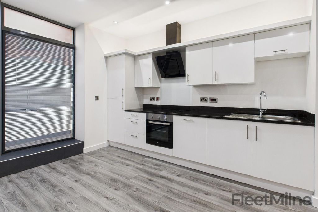 Property photo 2 of 13 Kitchen Area