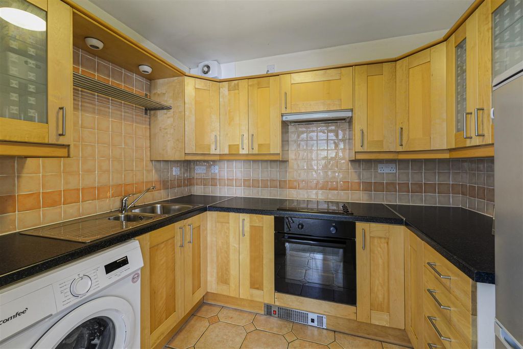 Property photo 3 of 12 Kitchen