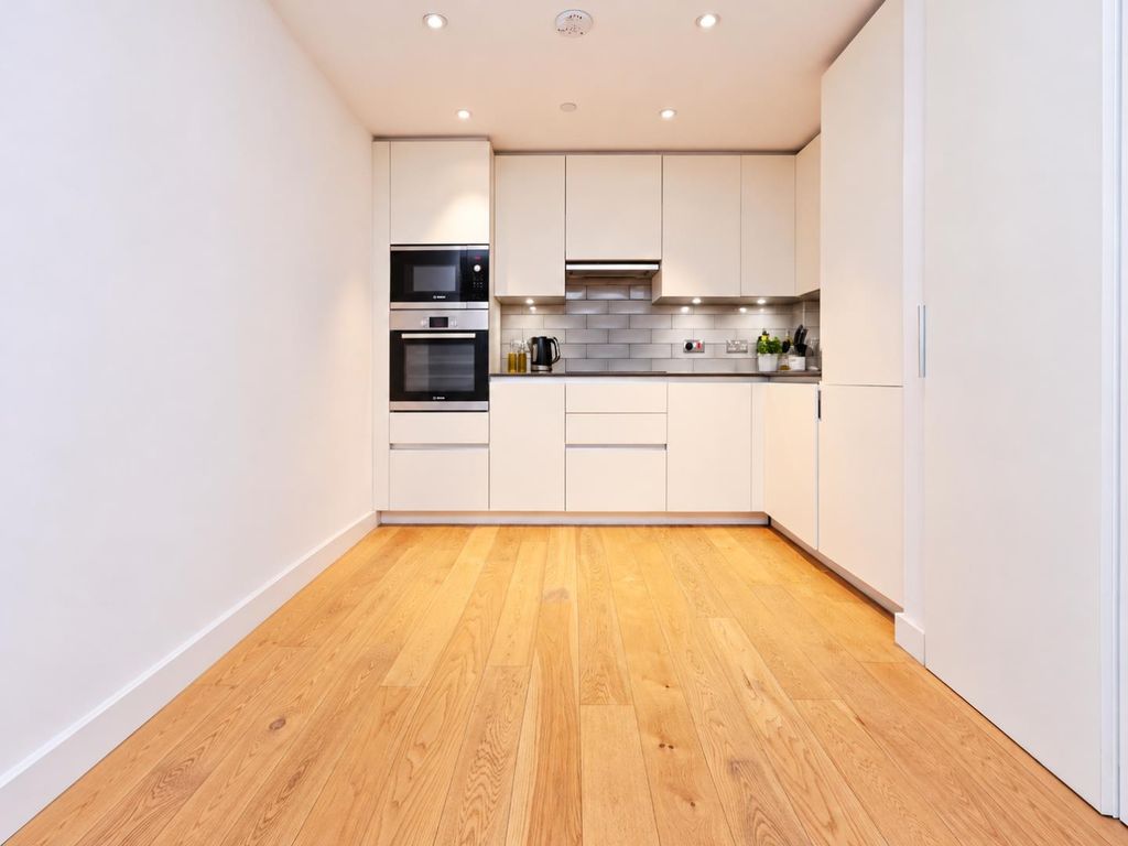 Property photo 2 of 12 Minimalist Cream Kitchen With Oak Flooring.Png