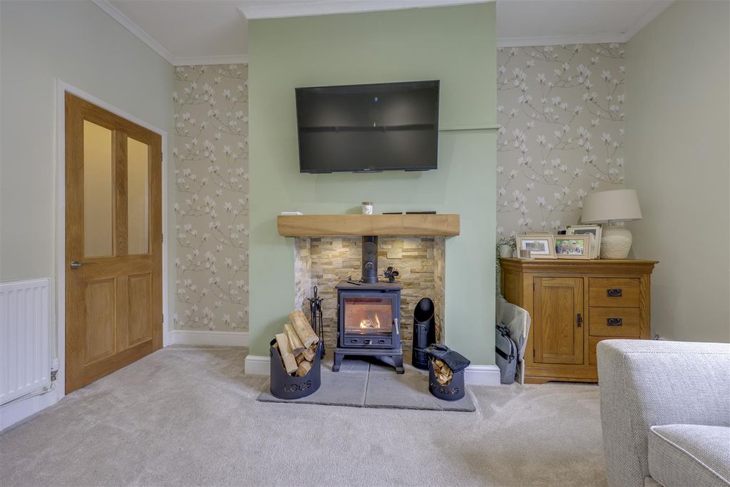 Property photo 3 of 16 Feature Woodburner